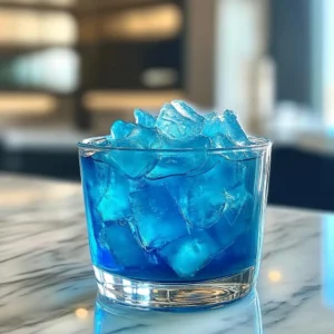 Blue salt trick recipe energy drink served with mineral-rich ice cubes in a glass.