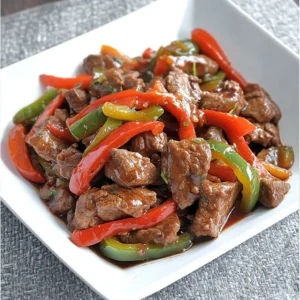 Jamaican-style stir fried steak with colorful bell peppers