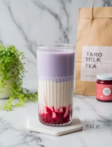 Creamy taro milk tea with red drizzle and layers