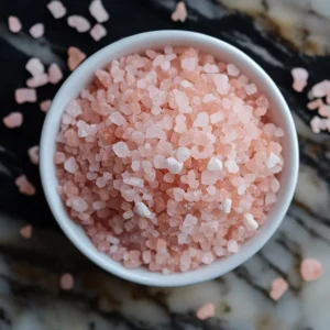 pink salt and lemon water before bed in glass mug
